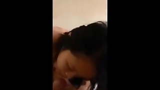 Singaporean phoning her boyfriend while blowing another man